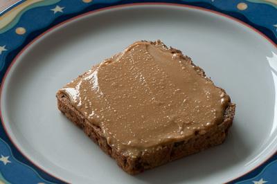 Peanut butter on a slice of bread